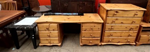 A pine chest of drawers together with a pine dressing table,