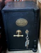 A small black painted Universal safe,