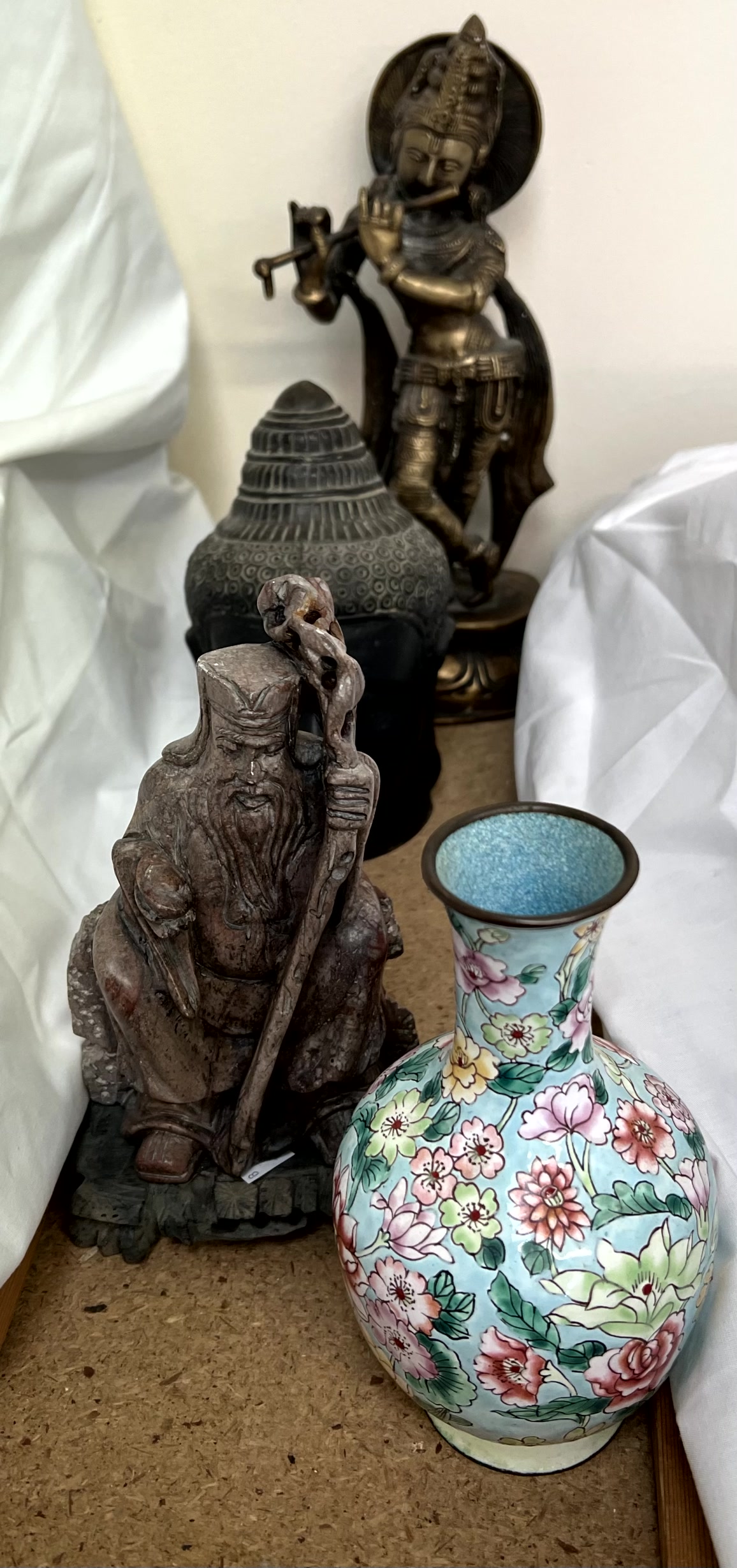 A Tibetan bronze figure together with a bronze buddha head,