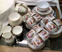 A continental porcelain part tea set together with other part tea sets,