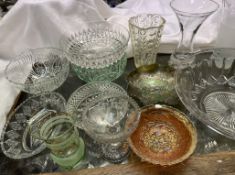 A carnival glass bowl decorated with a windmill and trees together with another carnival glass bowl,