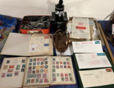 A collection of stamp albums together with first day covers including one posted aboard the QE2,