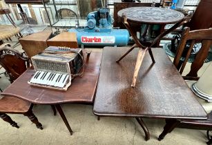An oak tripod table together with an Edwardian mahogany Sutherland table,