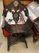 A Savonarola chair with carved decoration and mother of pearl inlay