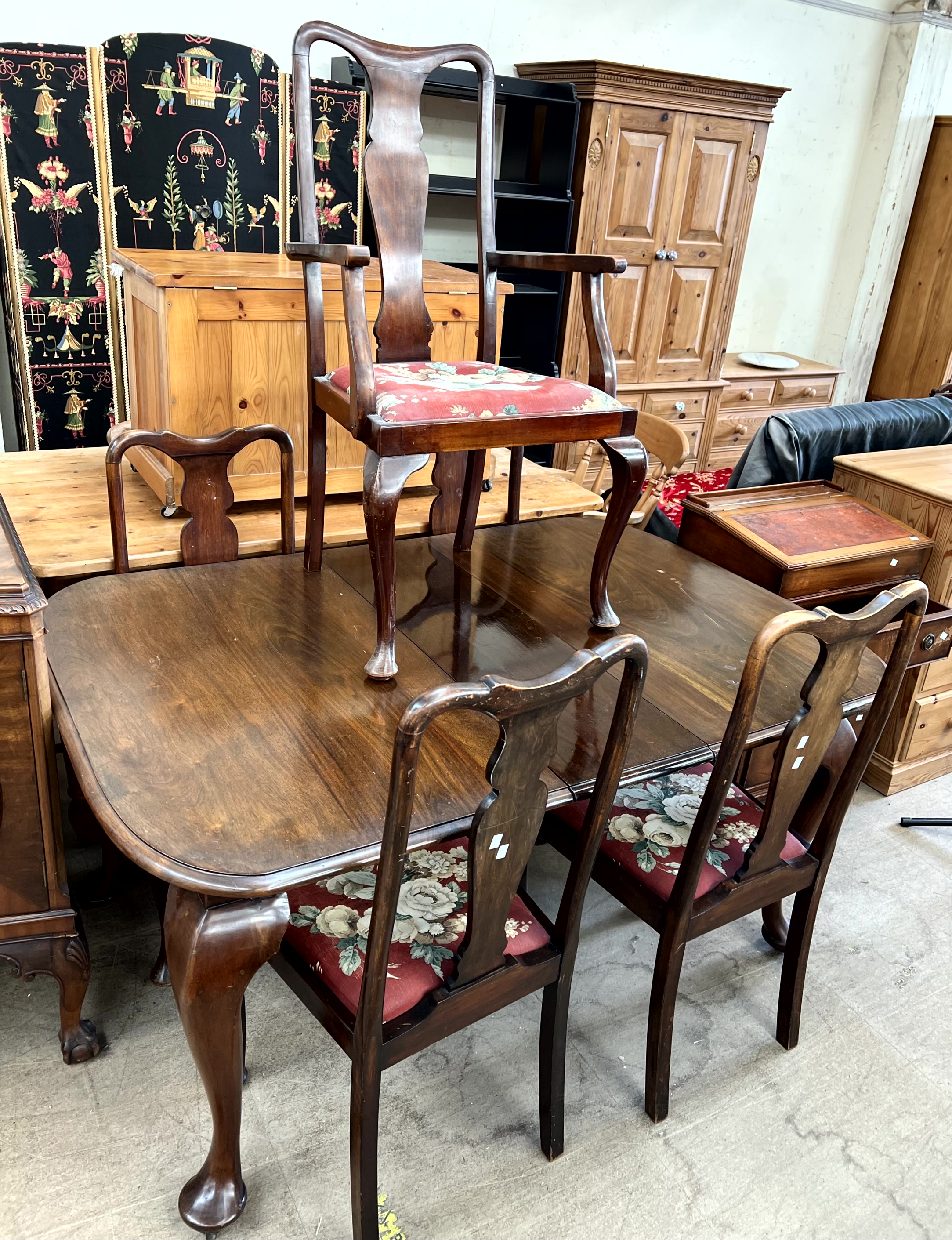 A 20th century mahogany dining suite including a sideboard,