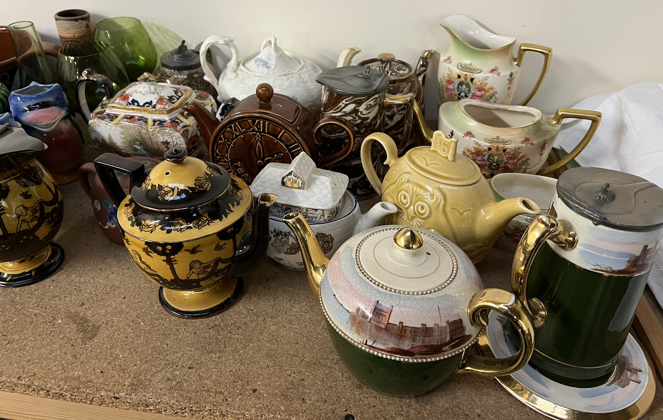 A Doulton Burslem Morrisian pottery teapot and hot water jug together with a collection of teapots, - Image 4 of 4