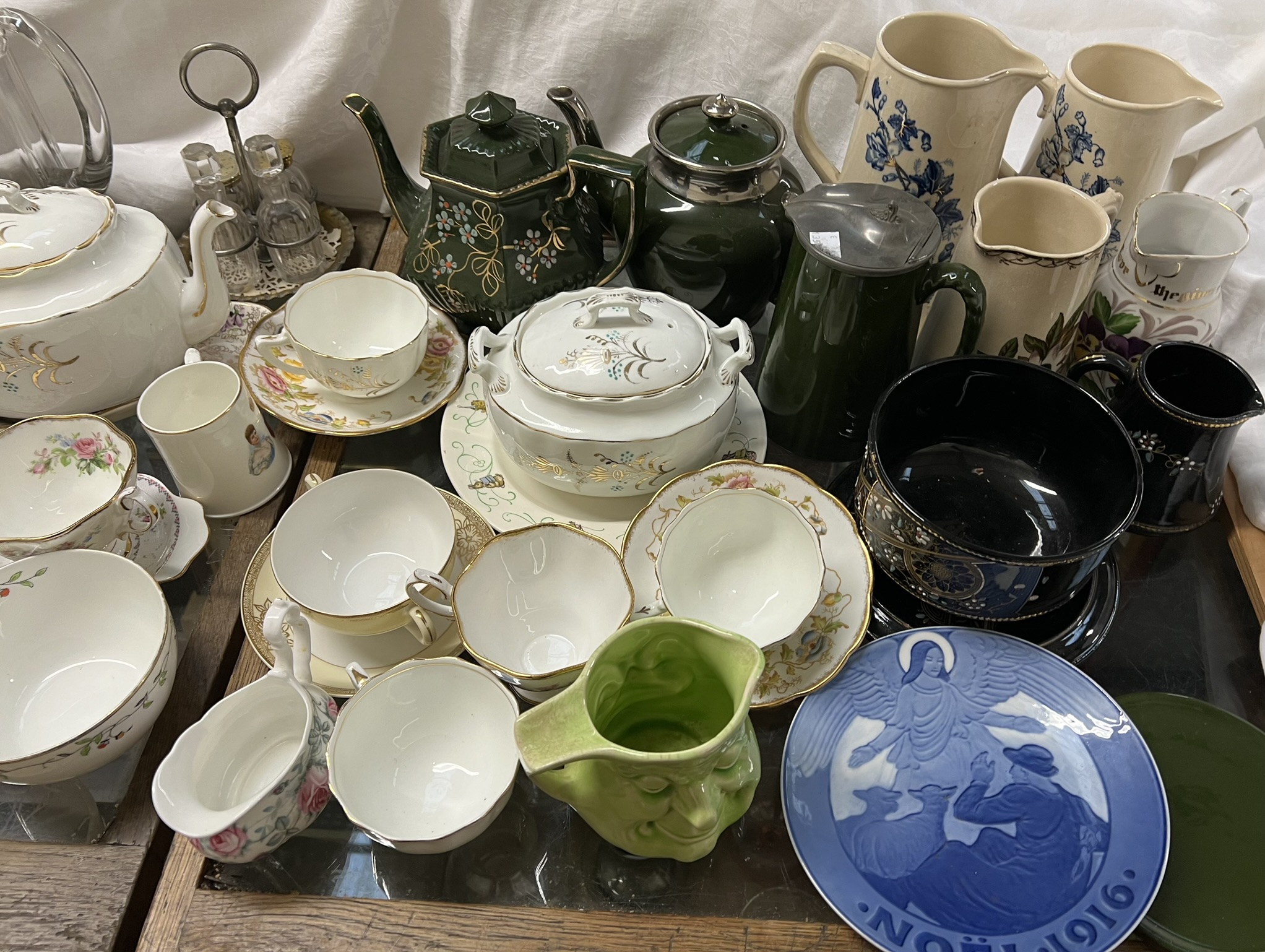 A collection of copper lustre jugs together with other jugs, teapots. - Image 2 of 3