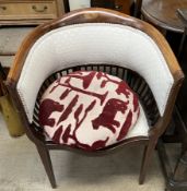 An Edwardian mahogany horseshoe shaped chair