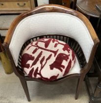 An Edwardian mahogany horseshoe shaped chair
