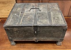 A continental table top cabinet with iron bindings on square feet