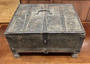 A continental table top cabinet with iron bindings on square feet