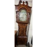 A 19th century mahogany longcase clock, the hood with broken swan neck pediment an baluster columns,