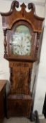 A 19th century mahogany longcase clock, the hood with broken swan neck pediment an baluster columns,