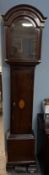 A 19th century mahogany long case clock case with an arched hood,