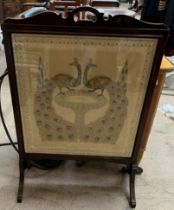 An embroidered fire screen,