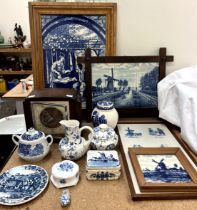 A framed set of six blue and white tiles depicting a pastoral scene together with other tiles,