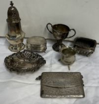A silver baluster sugar sifter together with a silver trinket box, a silver purse,