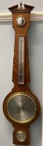 A Comitti of London aneroid barometer, with an alcohol thermometer,