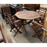 A garden table and four chairs together with a steamer chair