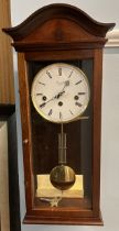 A 20th century mahogany Comitti of London three train wall clock