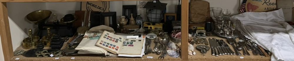 A large lot including flatwares, glasses, costume jewellery, coins, cufflinks, shells, lamp, stamps,