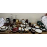 A brass cased barometer together with glass decanters, a Polish part tea service, other part sets,