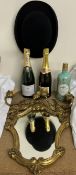 A bowler hat together with a gilt wall mirror, pair of gilt wall lights, Lanson champagne,