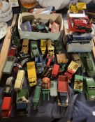 A Dinky Supertoys 514 Slumberland guy Van together with a 562 Dumper truck, 561 Blaw Knox Bulldozer,