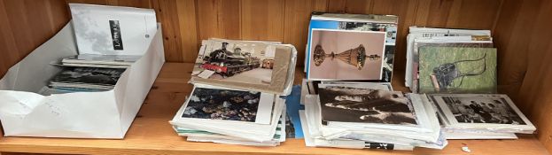 A large collection of postcards and postcard photographs