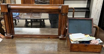A rosewood framed wall mirror of rectangular form with half section columns together with a