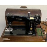 A Singer 201K sewing machine,