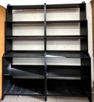A pair of modern ebonised waterfall bookcases