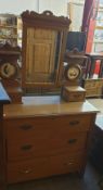 A satin walnut dressing table with a rectangular mirror and three drawers