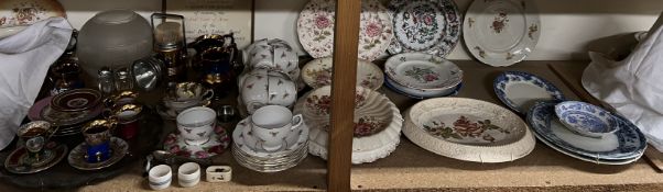 Two copper lustre jugs together with a floral decorated part tea service, bread plates,