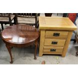 A 20th century oak bedside cabinet with three drawers on square legs together with an occasional