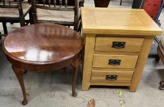 A 20th century oak bedside cabinet with three drawers on square legs together with an occasional