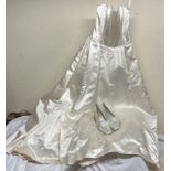 A Jasper Conran wedding dress together with a pair of Gabriella & Lucido shoes