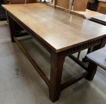An oak refectory table, with a rectangular top on square legs and stretchers,