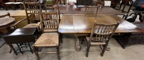 An oak drawleaf dining table together with five spindle back dining chairs and a small drop leaf