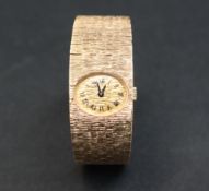 A 9ct gold Ladies Bueche - Girod wristwatch, with an oval dial and Roman numerals,