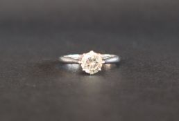 A solitaire diamond ring set with a round brilliant cut diamond, approximately 0.