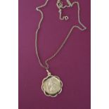 A 9ct gold St Christopher on a 9ct gold chain,
