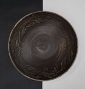 Attributed to Abdo Nagi a stoneware bowl with sgraffito decoration of flower and berries,