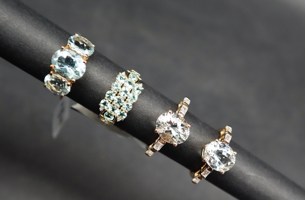 Gemporia - A 9ct gold aquamarine and white zircon ring, set with 3.