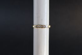 An 18ct yellow gold diamond ring set with princess cut diamonds, size N,