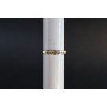 An 18ct yellow gold diamond ring set with princess cut diamonds, size N,