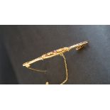 A 9ct gold amethyst and seed pearl bar brooch approximately 2.