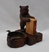 A Black Forest desk top bear matchbox holder and ashtray 12.