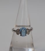 An 18ct white gold diamond and Cabochon cut dress ring, size O, approximately 3.