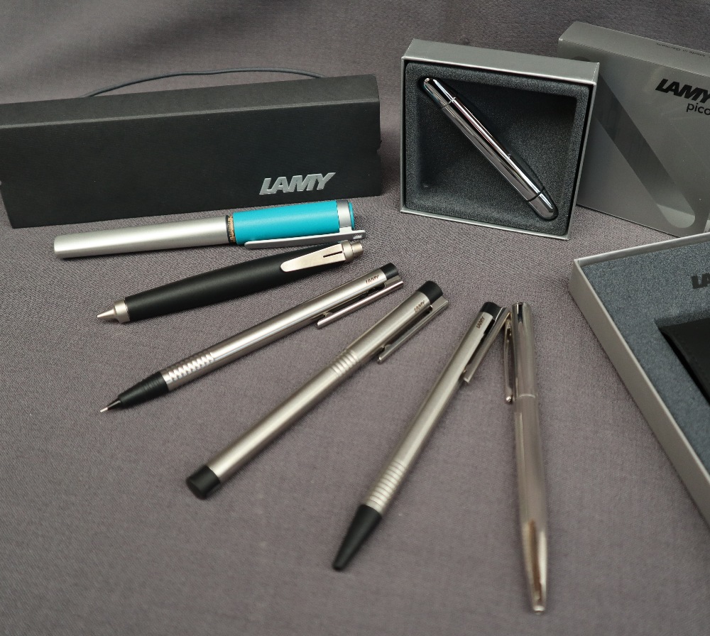 Two Lamy fountain pens together with two Lamy ballpoint pens,